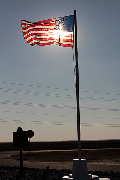 USA flag with the sun behind