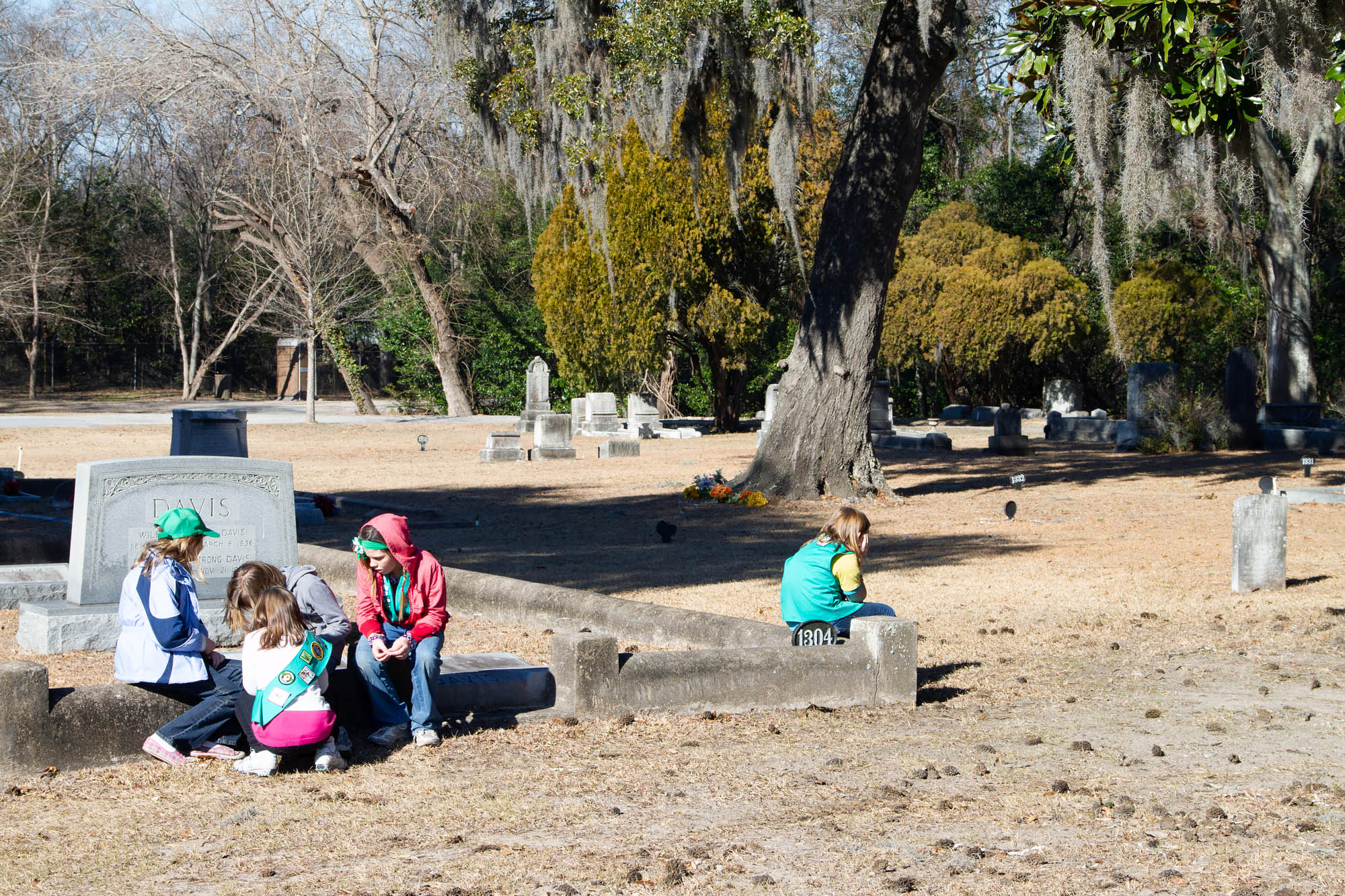 Kids playing at a cemetery