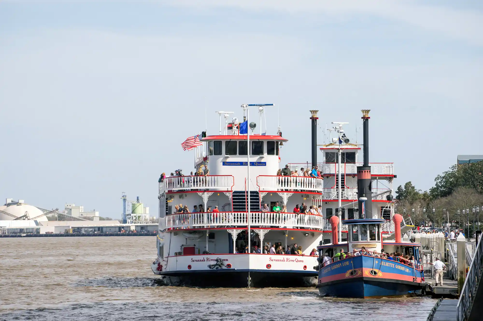 Savannah River Street steamboats in white and read with flag