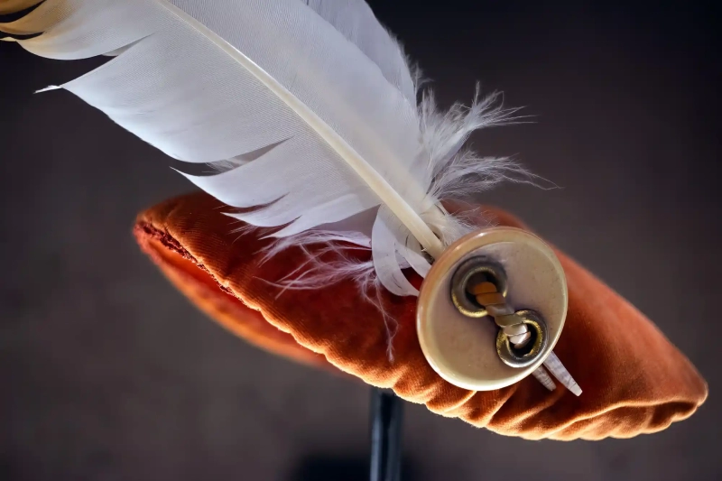 Narrow button and feather lady hat