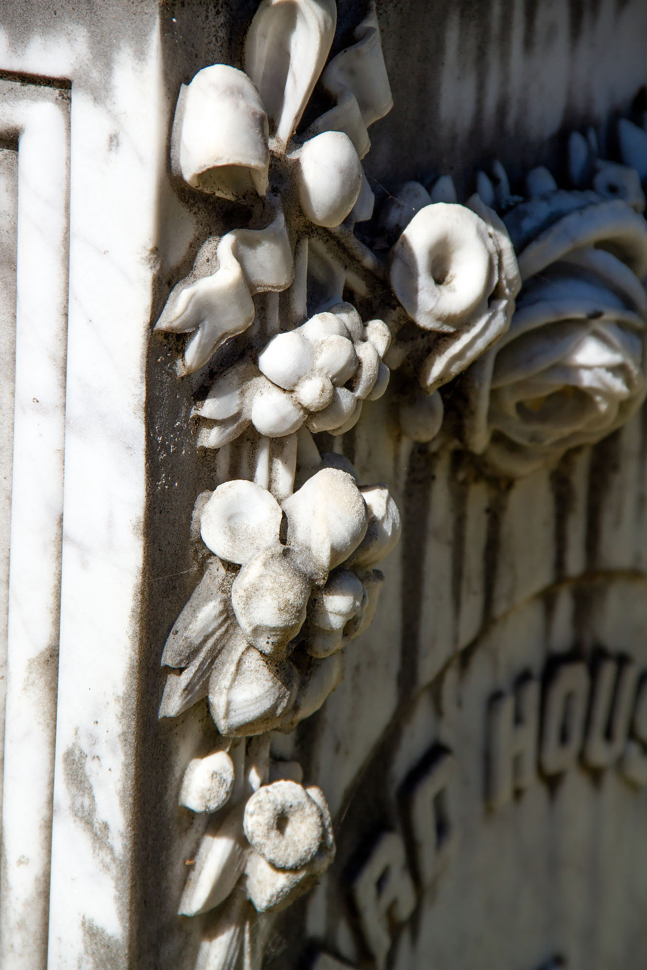 Flowers in marble gravestone